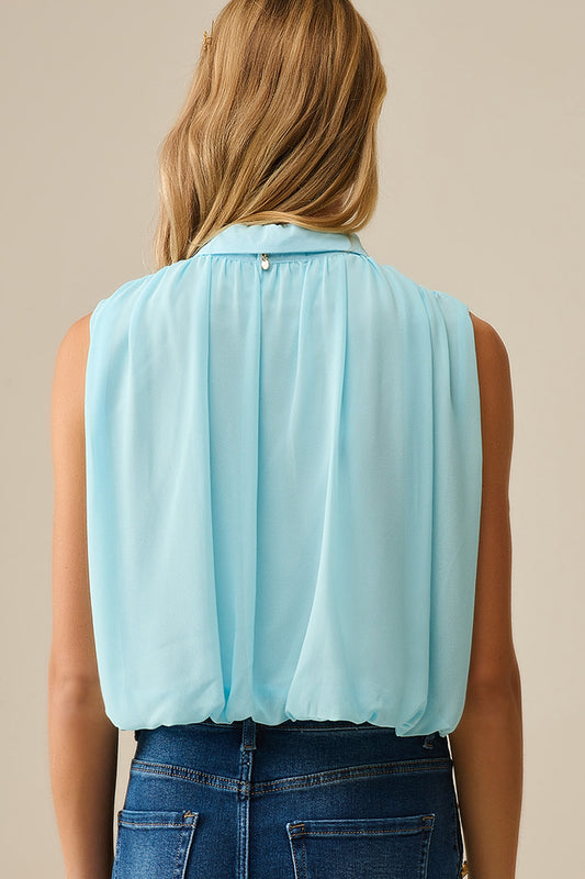 baby blue chiffon blouse with pleats at the hem