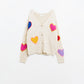 Beige knitted cardigan with embroidered hearts