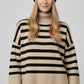 Beige oversized turtleneck sweater with black stripes and splits on the side