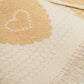 beige scarf with heart print and golden thread detail