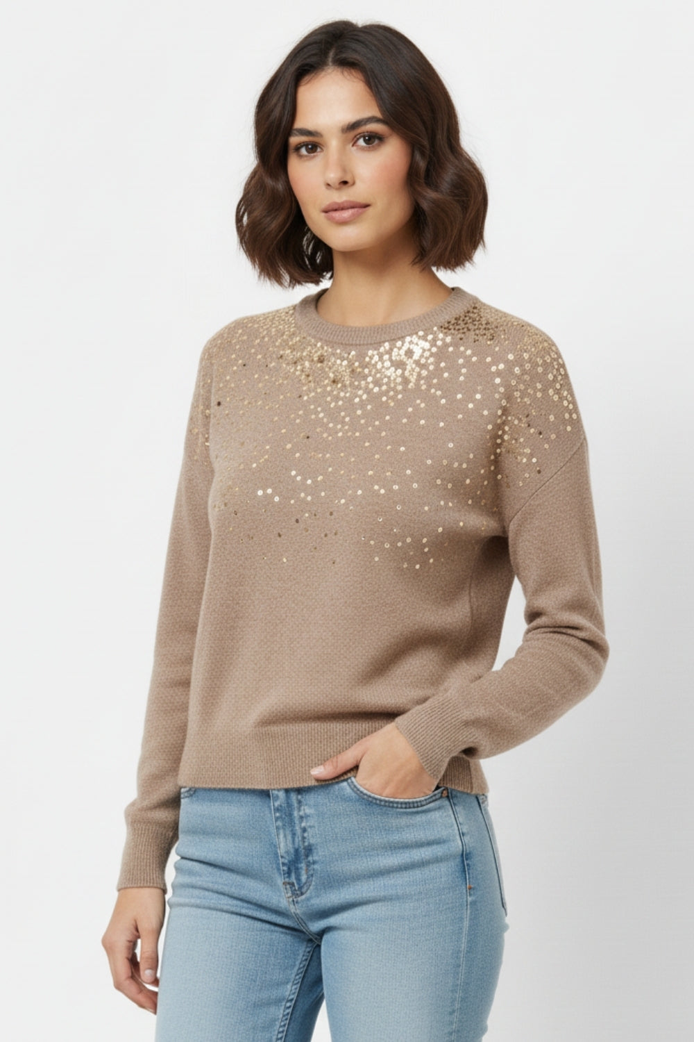 Beige soft knit sweater embellished with sequins on the front