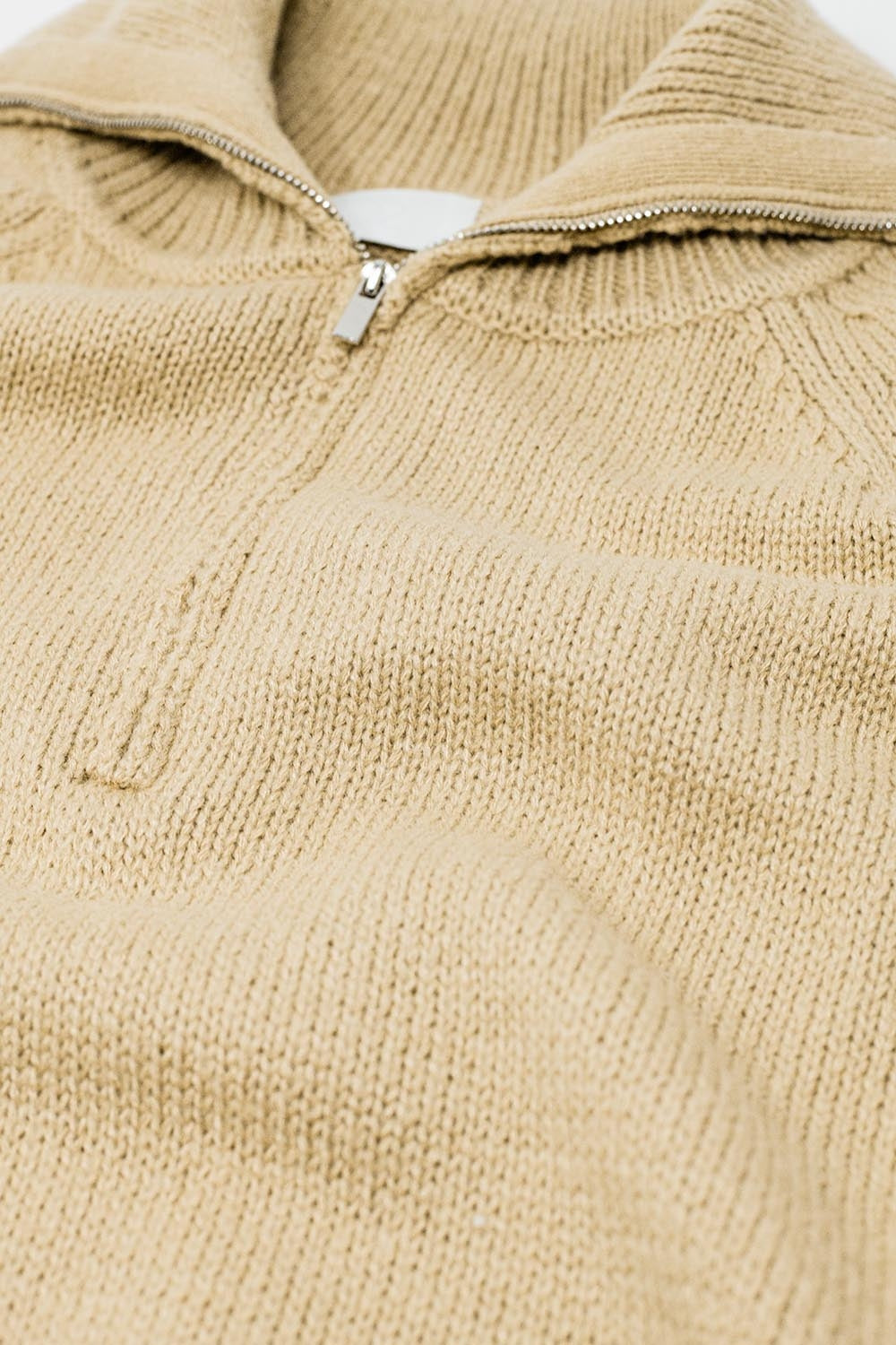 beige sweater with zipper closure