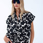 Black and white floral print shirt with short sleeves