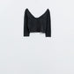 Q2 Black cropped top with elastic straps on the back