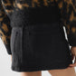 Black denim miniskirt with cargo pockets