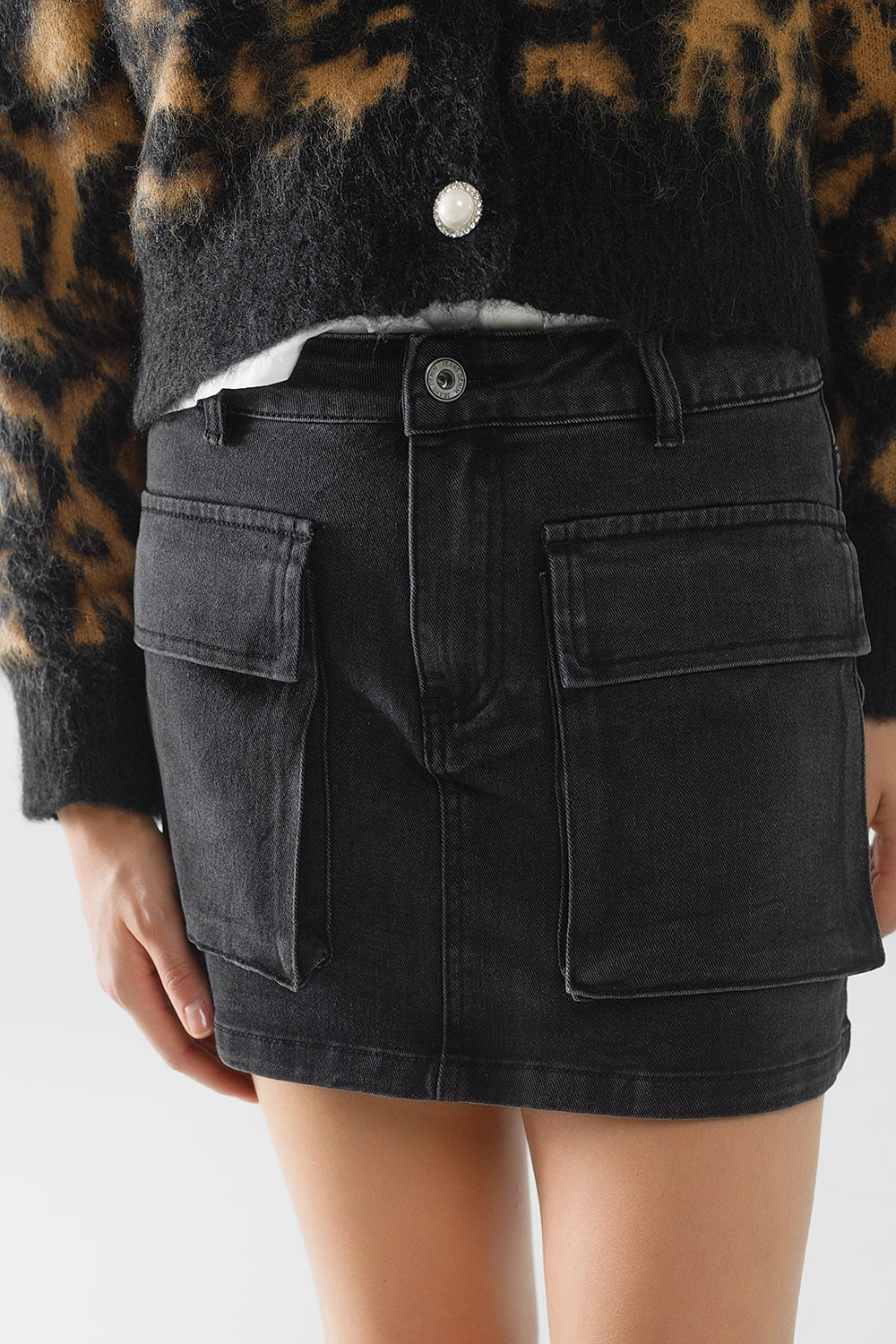 Black denim miniskirt with cargo pockets