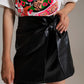 Black faux leather mini skirt with bow on the side