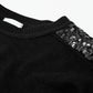 Black long sleeves sweater with sequins on the shoulders