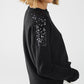 Black long sleeves sweater with sequins on the shoulders