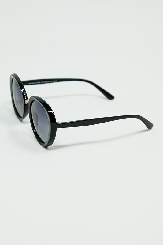 Black Oval Shaped Sunglasses with metal gold detail