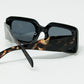 Black square sunglasses with brown animal print on the side