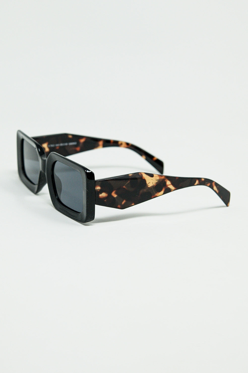 Black square sunglasses with brown animal print on the side