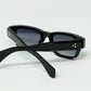 Black sunglasses with oval frame with gold detail