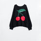 Q2 black sweater with cherry print