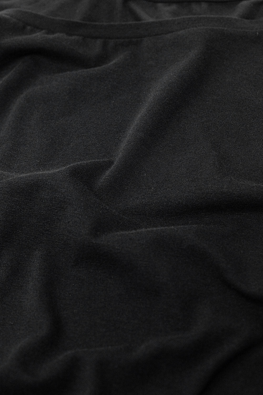 Black T-shirt made of fine stretch fabric with a boat neck