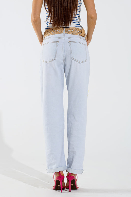 Vaqueros holgados desteñidos con diseño floral multicolor