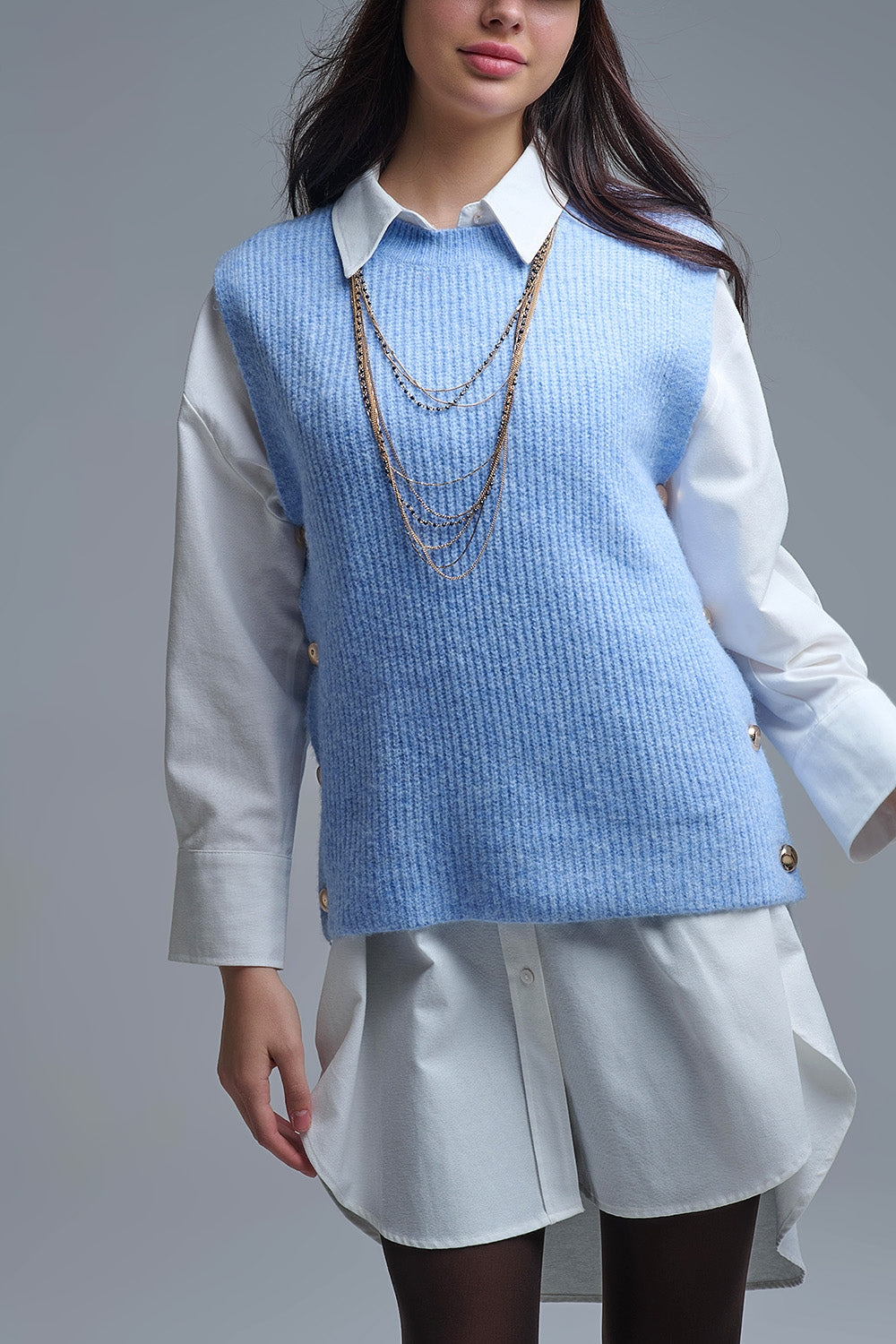 Q2 Blue sleeveless sweater with gold buttons on side