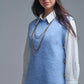 Blue sleeveless sweater with gold buttons on side