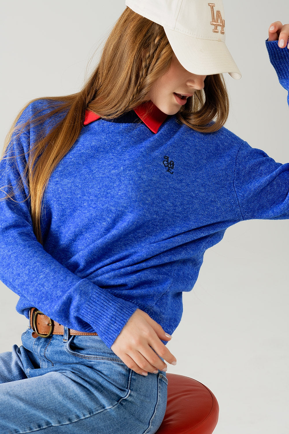 Q2 Blue sweater with contrasting collar and love logo on chest