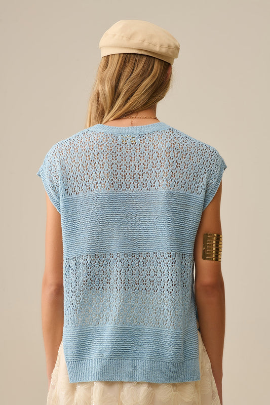 Blue sweater with soft open knit and dropped sleeves