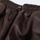 Brown faux leather shorts with gathering at the waist with drawstring