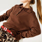 Q2 Brown loose sweater with button closure