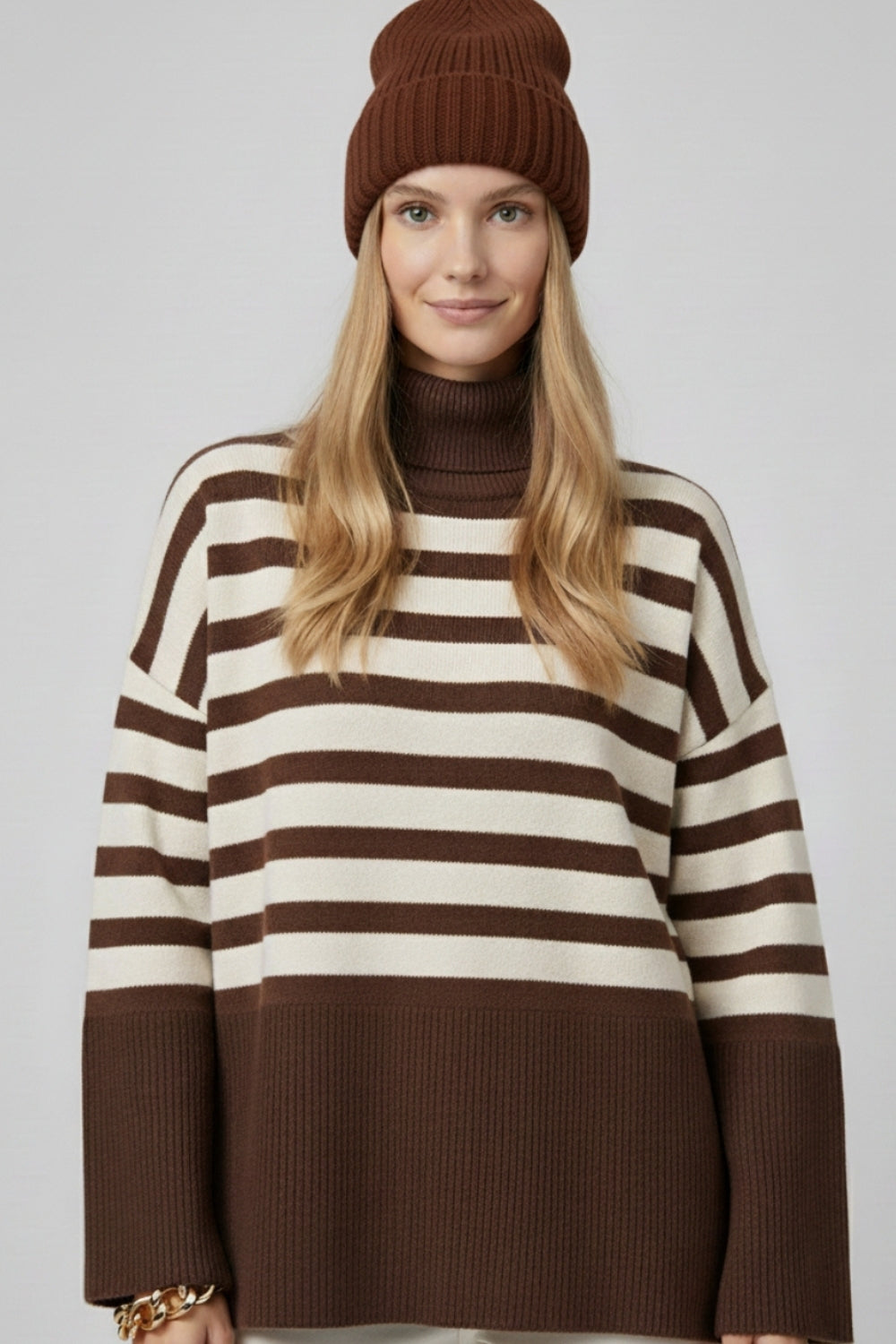 Brown oversized turtleneck sweater with white stripes and splits on the side