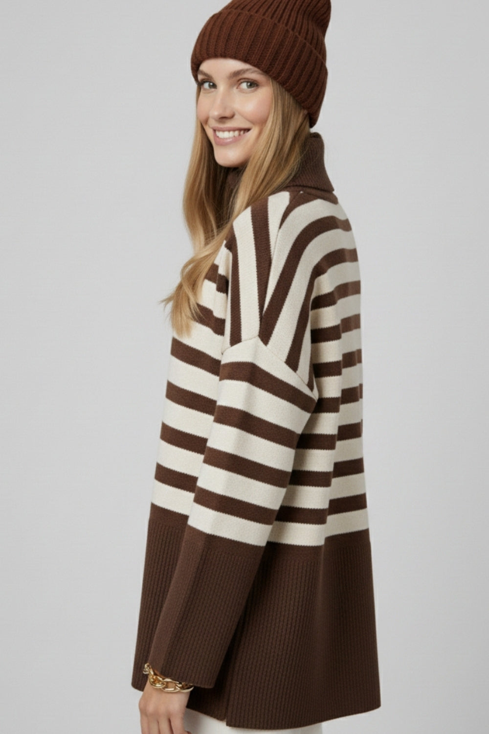 Brown oversized turtleneck sweater with white stripes and splits on the side