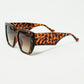 Brown pin-up style sunglasses with geometric design and cat eyes