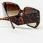 Brown pin-up style sunglasses with geometric design and cat eyes