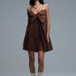 Brown poplin mini dress with a big bow detail