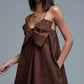 Brown poplin mini dress with a big bow detail
