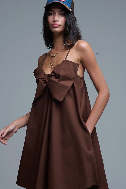 Brown poplin mini dress with a big bow detail