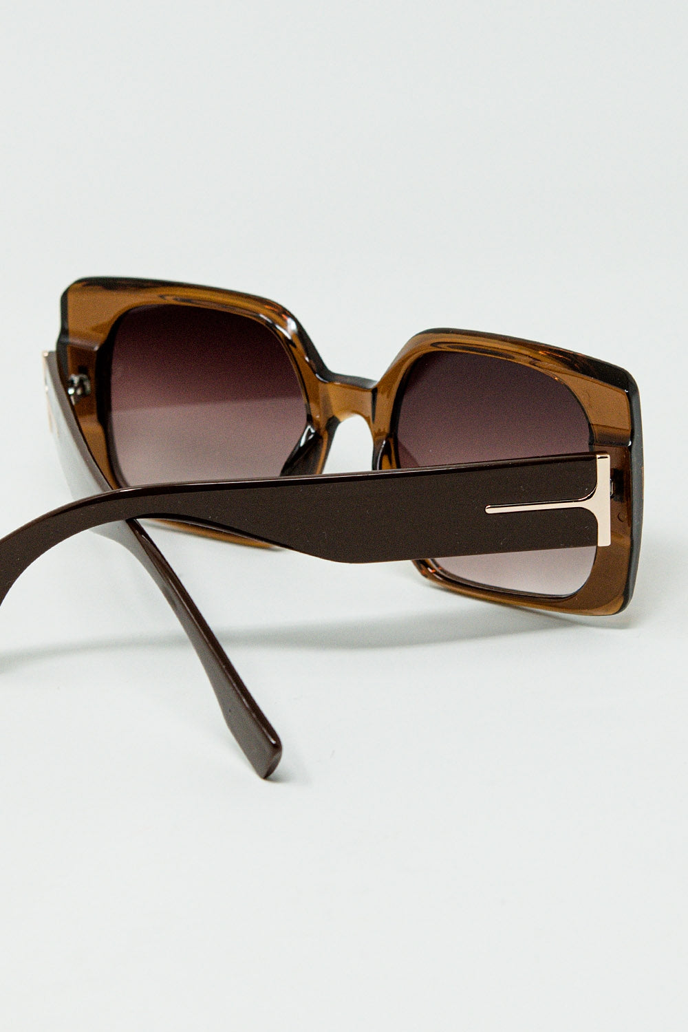 Brown square sunglasses with gold detail on the side