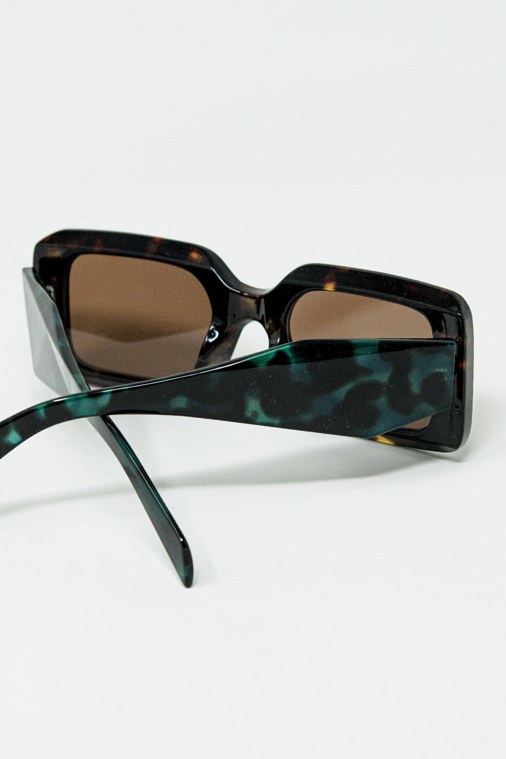 brown square sunglasses with green animal print on the side