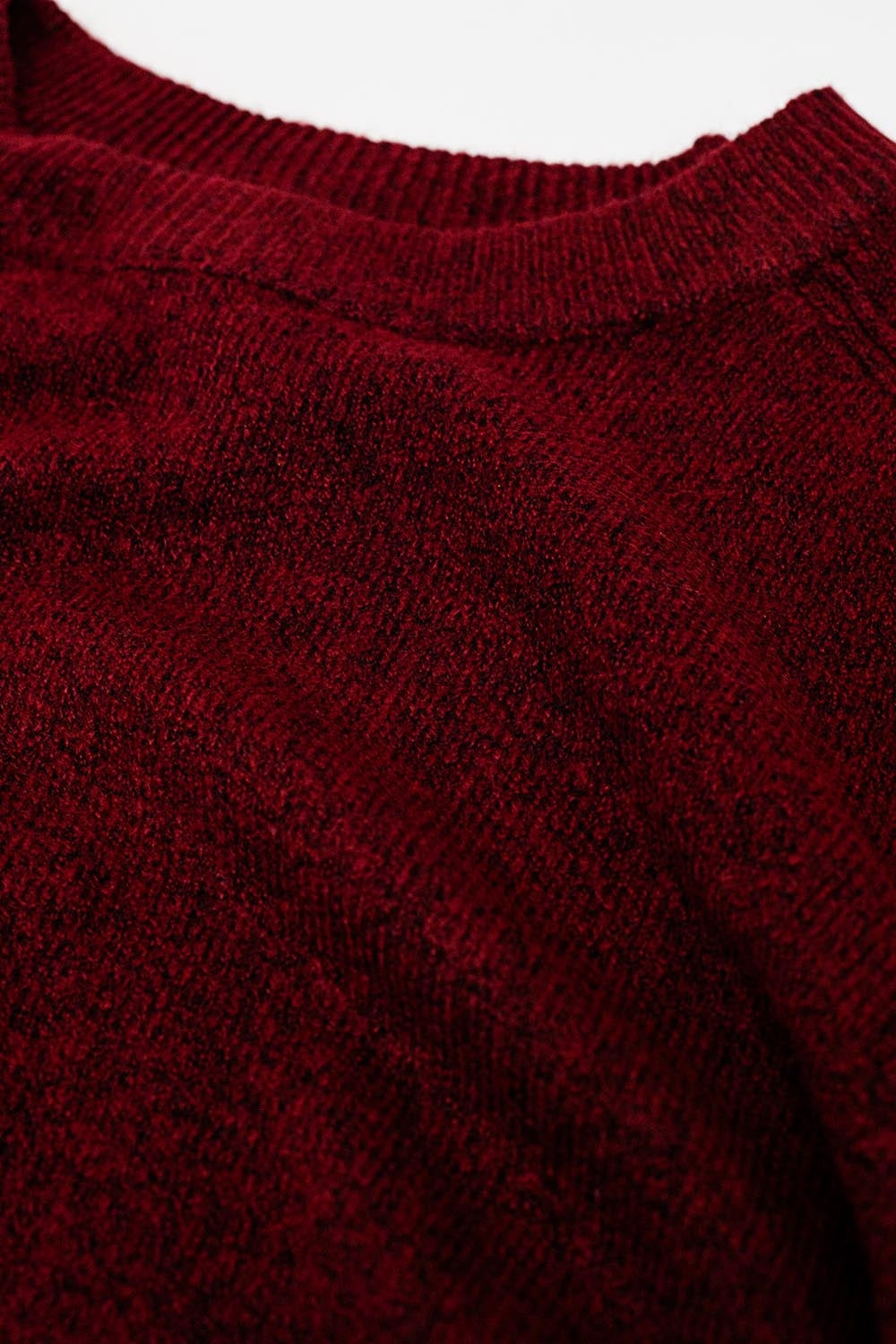 Burgundy crew neck sweater with seam detail on sleeve