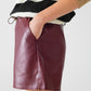 Burgundy faux leather shorts with gathering at the waist with drawstring