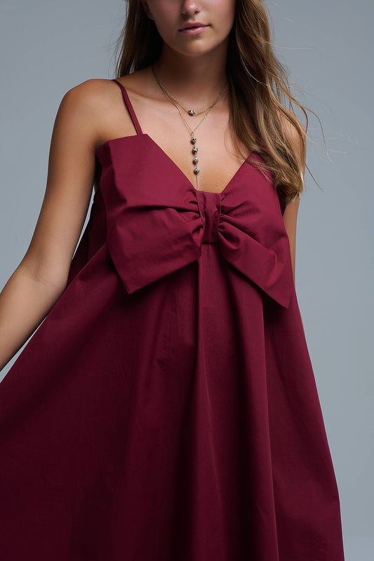 Burgundy poplin mini dress with a big bow detail