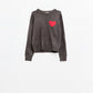 carbon grey sweater with red heart detail