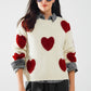 Q2 cozy white sweater with red hearts