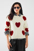 Q2 cozy white sweater with red hearts