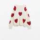 cozy white sweater with red hearts