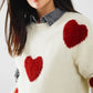 cozy white sweater with red hearts