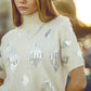 Cream short sleeve sweater with sequin embellishment