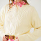 Cream soft knit sweater with cable pattern