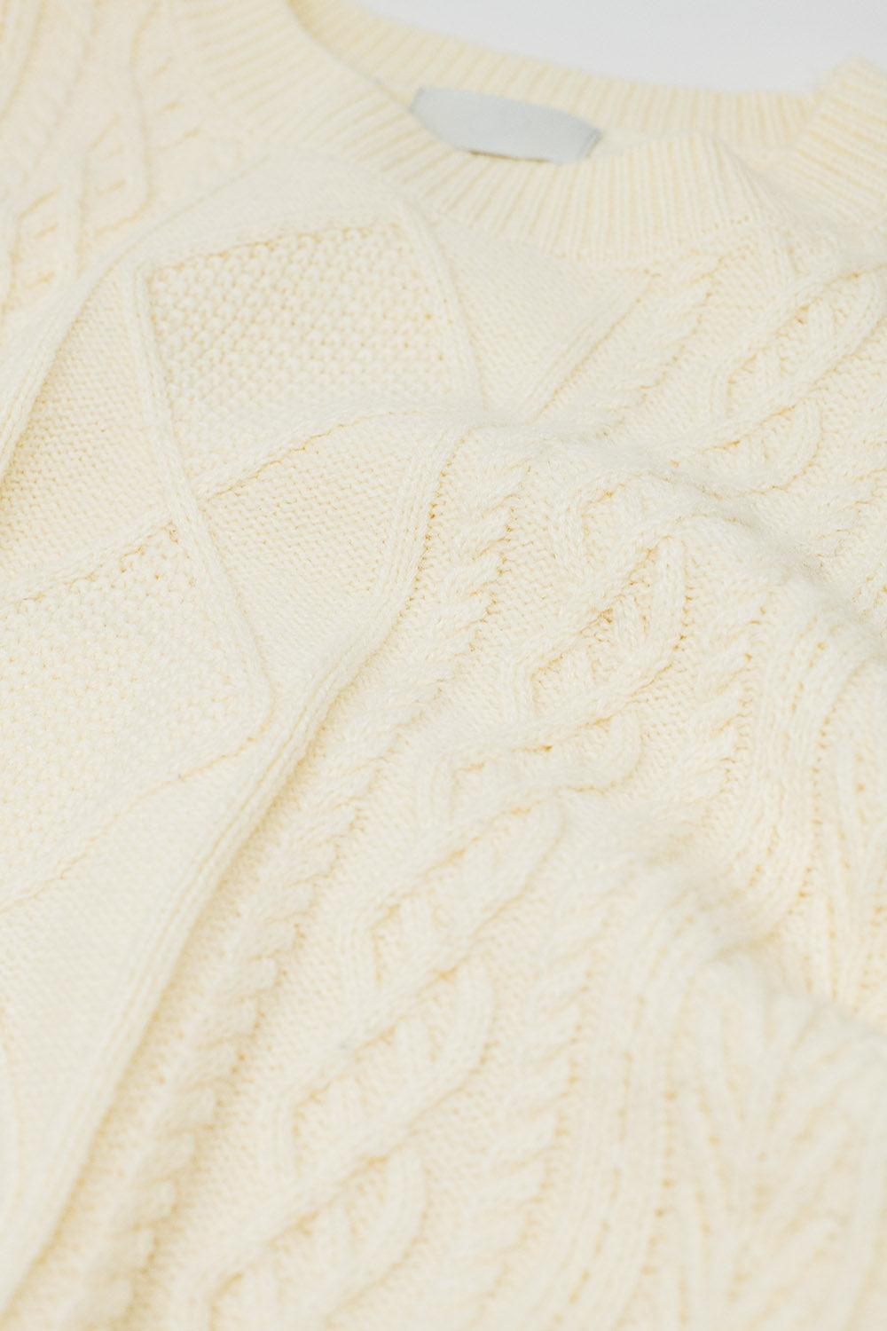 Cream soft knit sweater with cable pattern