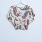 Crop top con estampado paisley