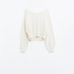 cropped fluffy sweater in cream fitted at the waist