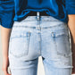 Distressed straight jeans with hem detail in blue