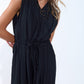 draped black jumpsuit in crinkled fabric